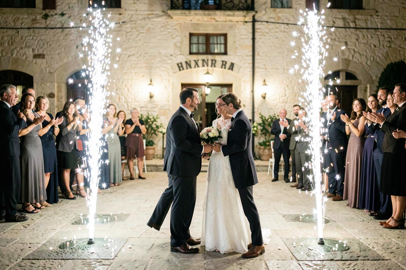 Couple entering through cold spark fountains